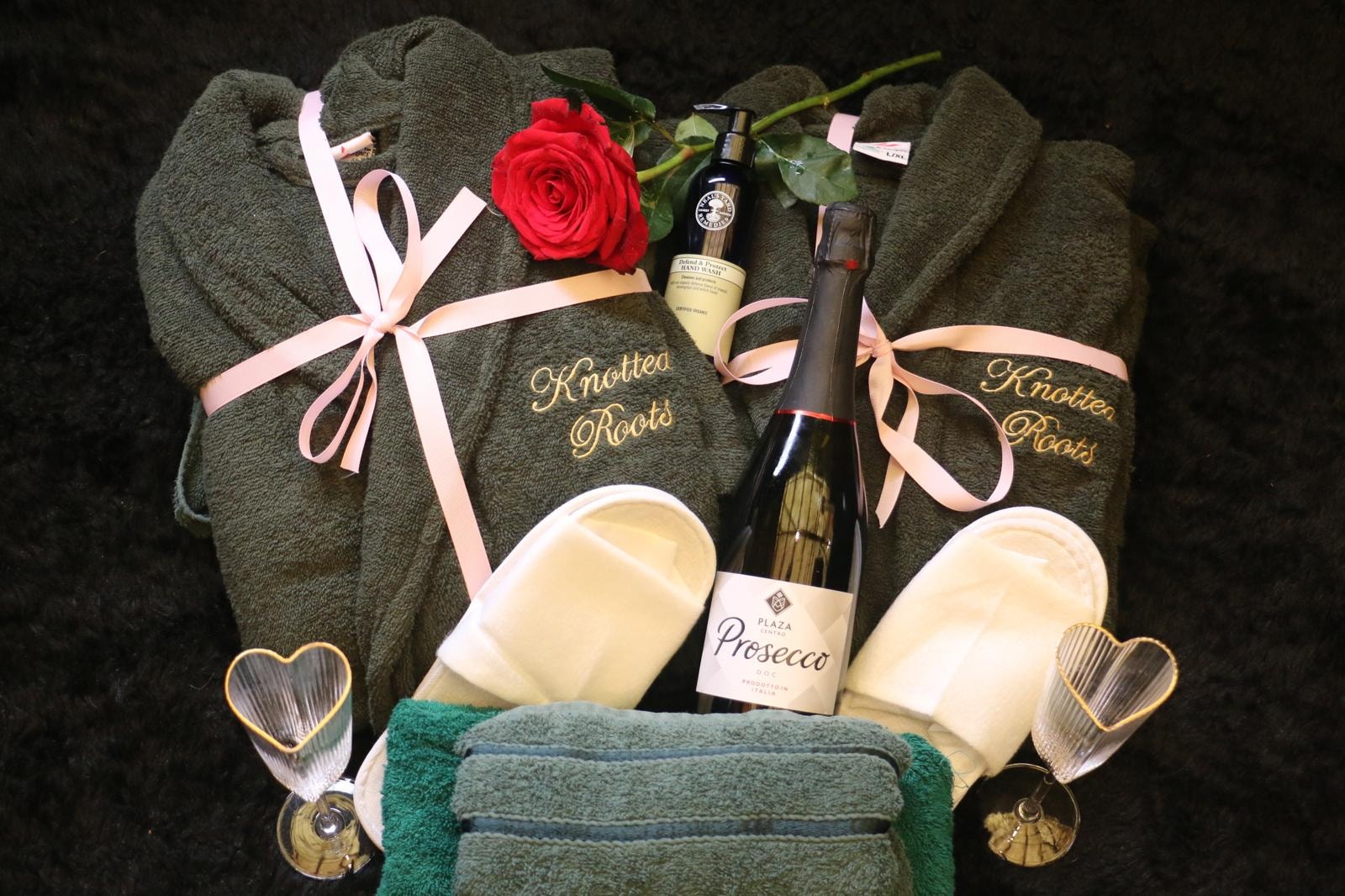 Knotted Roots welcome hamper with robes, prosecco and slippers